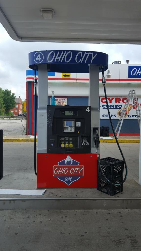 Gas pump with Ohio City Gas branded panel and an illuminated OHIO CITY pump topper