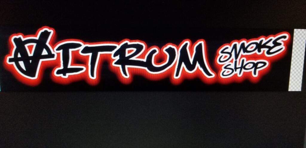 Illuminated Vitrum Smoke Shop lightbox face with red glow behind black graffiti lettering