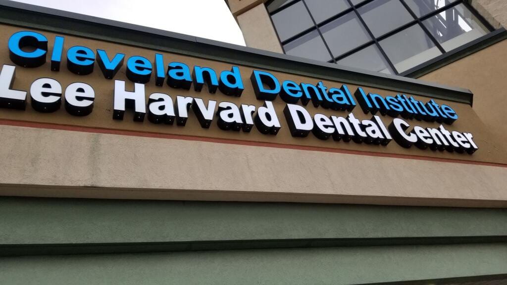Blue and white Cleveland Dental Institute and Lee Harvard Dental Center channel letters