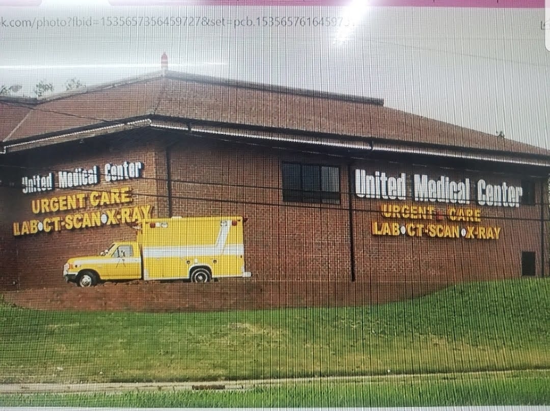 United Medical Center wall letters reading URGENT CARE LAB CT SCAN X-RAY beside a painted ambulance mural