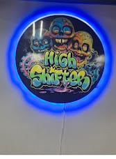 Round High Shifters logo sign with blue halo glow on an interior wall
