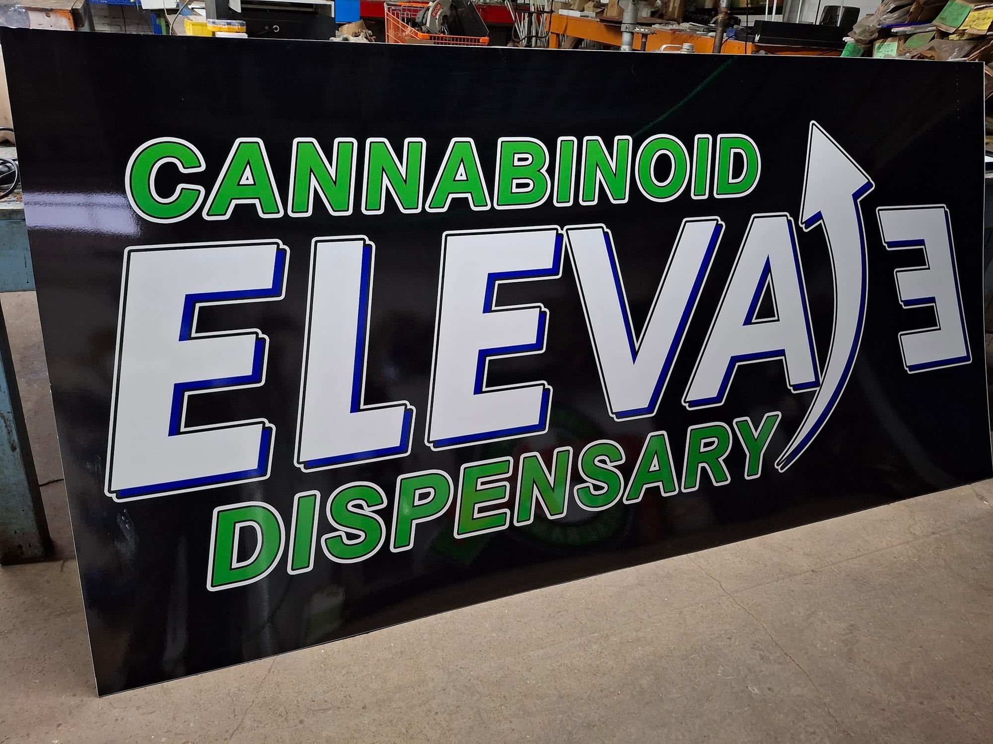 Cannabinoid Elevate Dispensary printed sign panel standing in the shop