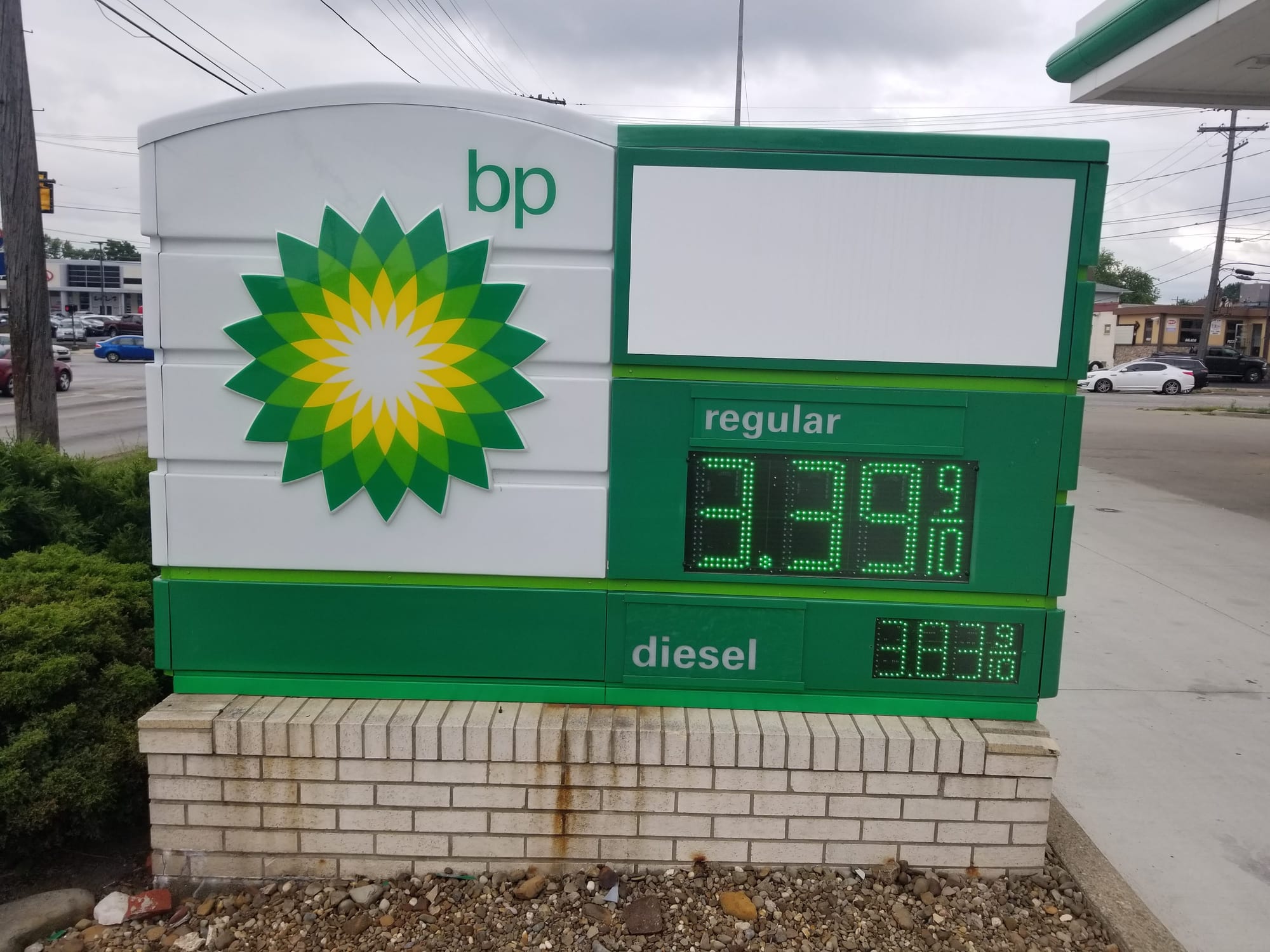 bp branded monument sign with an LED fuel price display on a brick base