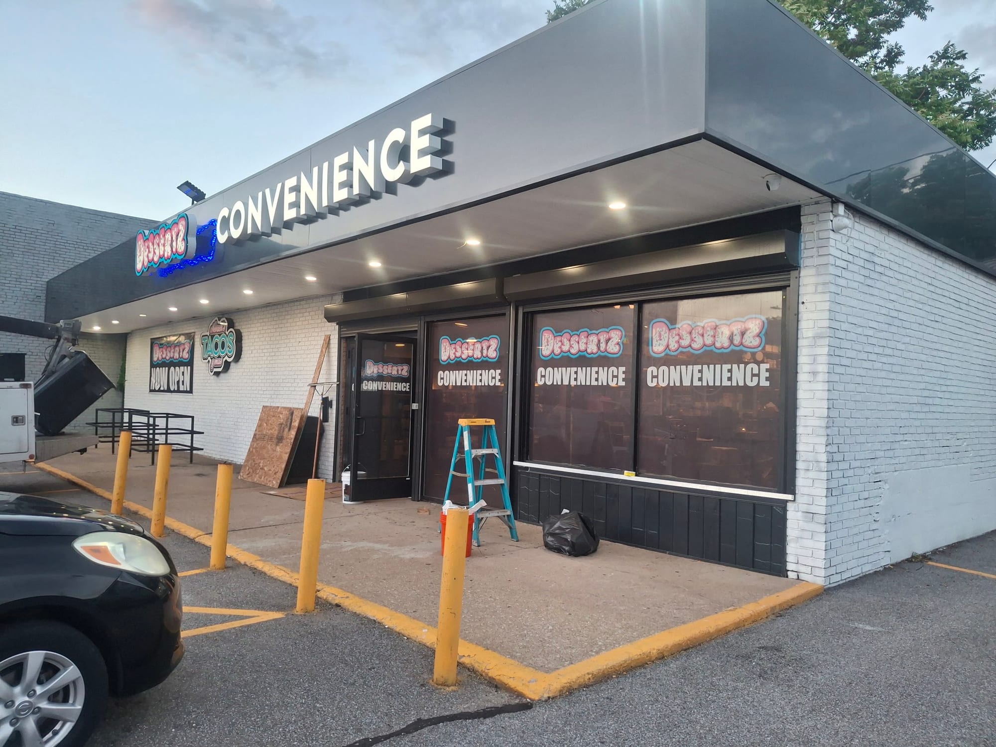 Dessertz and CONVENIENCE signs with matching window decals, ladder at the entrance