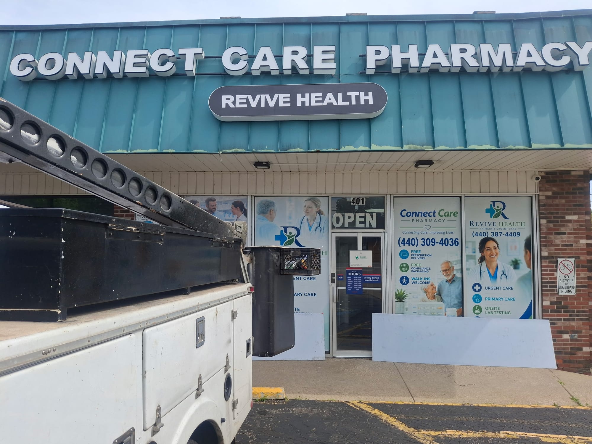 CONNECT CARE PHARMACY channel letters and a REVIVE HEALTH cabinet sign above a storefront